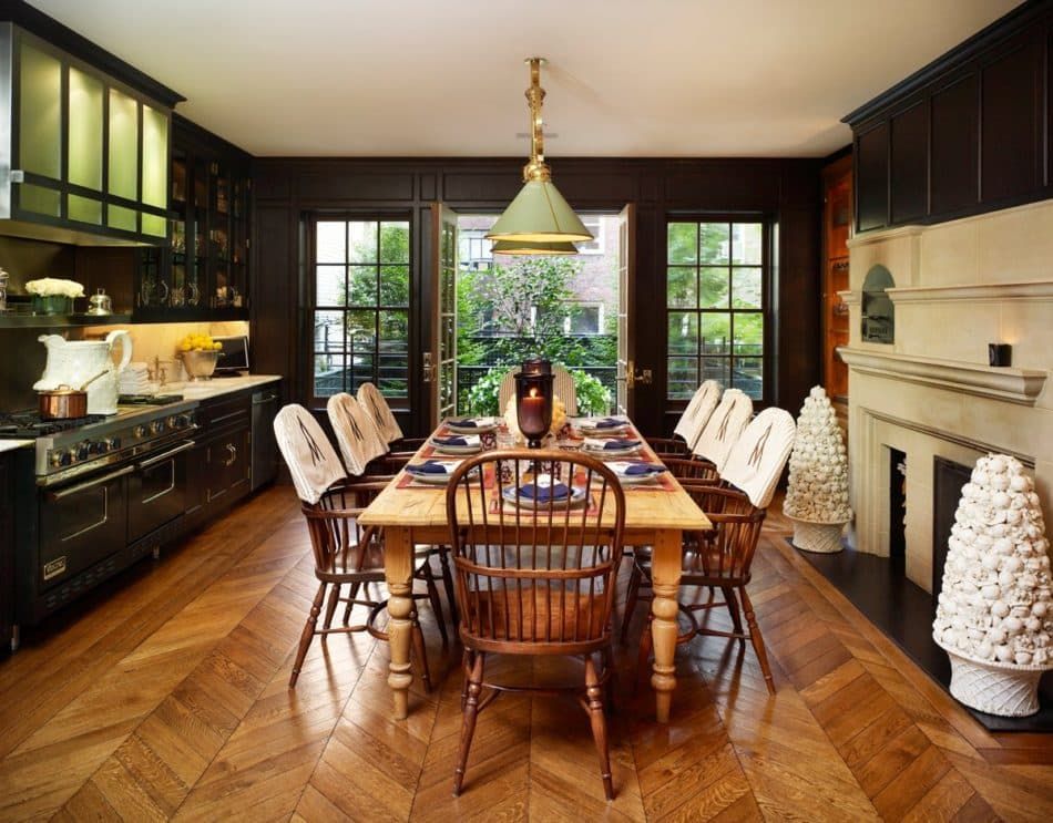 Herringbone wood floors add warmth to this kitchen in a townhouse by Kirsten Kelli on New York's Upper East Side.