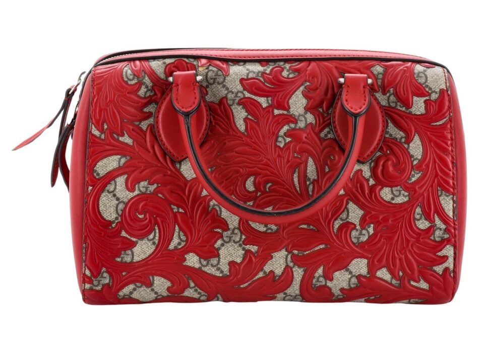 A Gucci Boston bag in a bright red coated Arabesque canvas in bright red. 