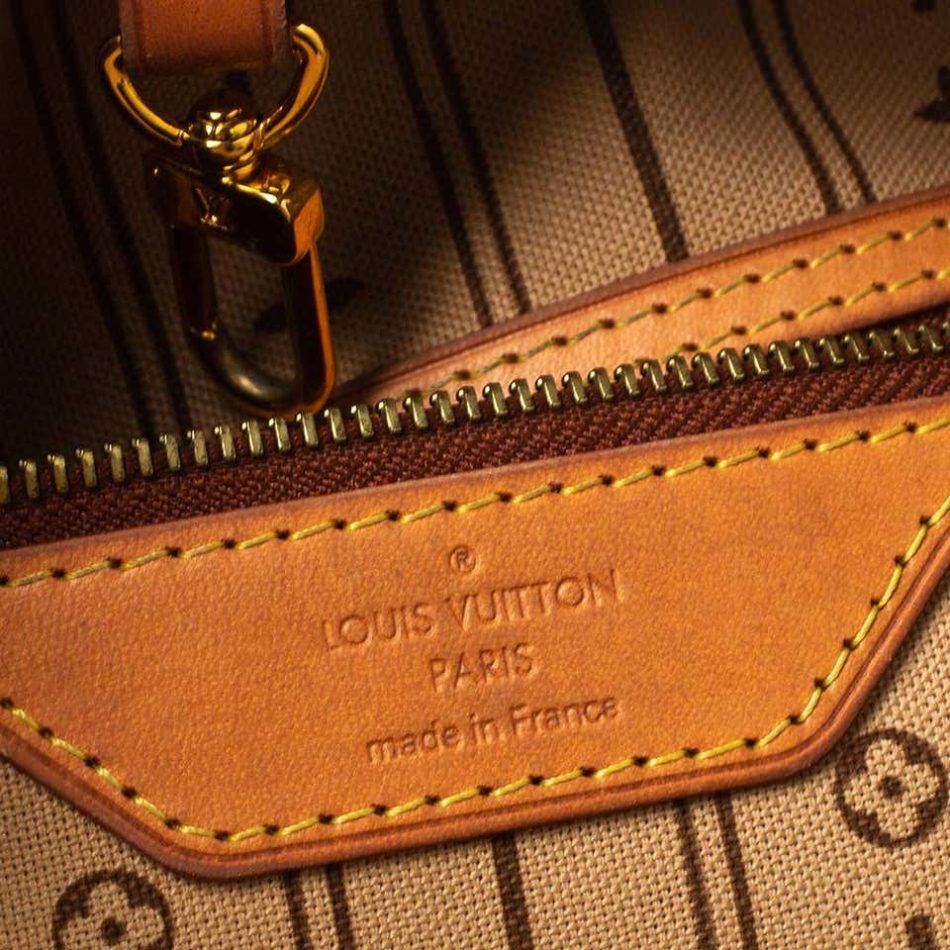 A photograph of the interior lining of a Louis Vuitton Neverfull bag.