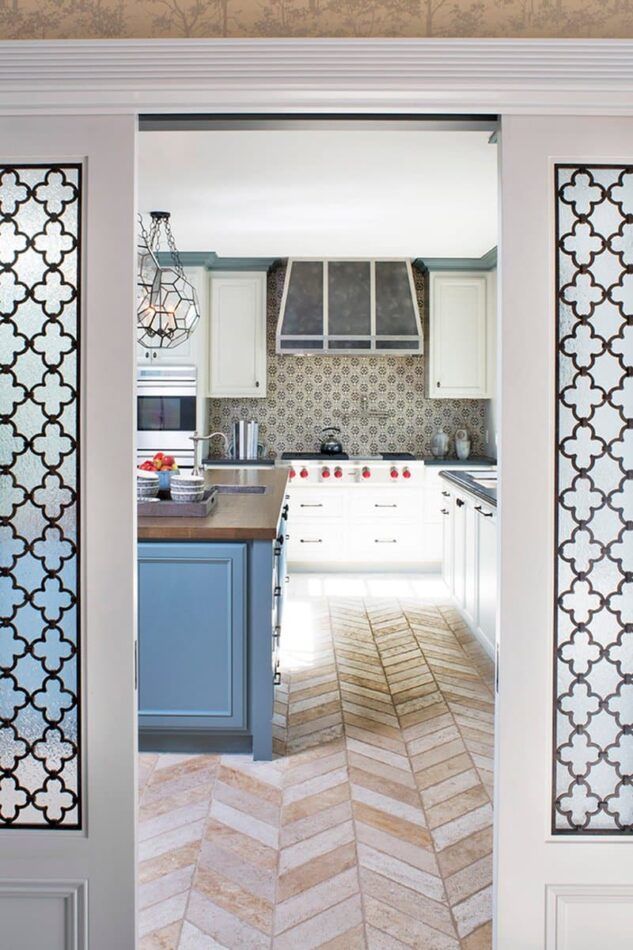 For this 1937 Federal-style home in Los Angeles, Annette English combined several smaller rooms to create a large, open kitchen, with herringbone travertine flooring.