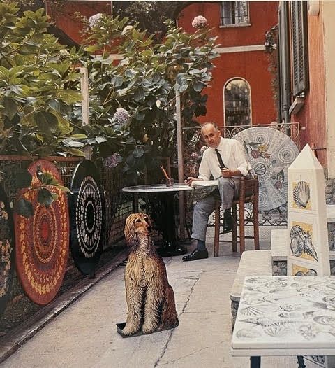 Fornasetti sits among works including his Afghan hound umbrella stand 