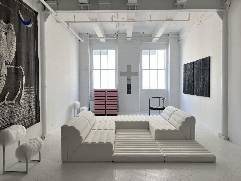 At Duplex gallery, contemporary re-issues of the Free System Sofa (1973) by Claudio Salocchi and Nanda Vigo's pink Storet chests of drawers (1994) and white Due Pui arm chairs (1971), all for Acerbis. In the back is an original 1958 Catilina chair by Luigi Caccia Dominioni for Azucena.