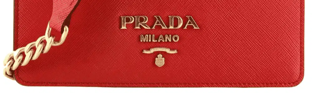 don't know where else to ask: is this nylon Prada tote fake?! Just bought  from Vestiaire but have doubts on the logo(could VTG items have  discrepancies?). They said it's authenticated but now