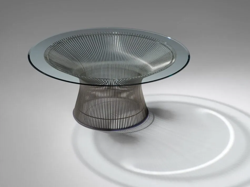 A Warren Platner coffee table with a spherical base made of steel rods that flare out at the top to support a glass tabletop. 
