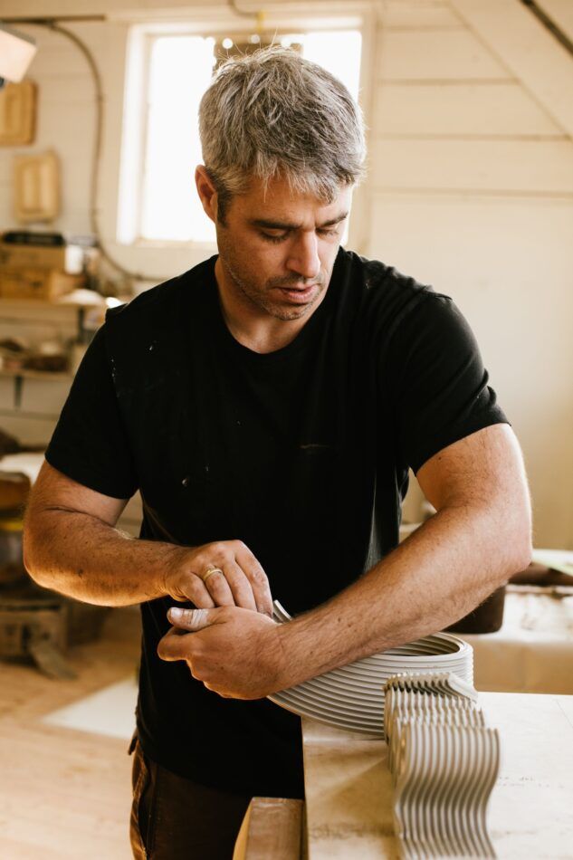 Jeff Martin handworks raw clay in his Vancouver studio.